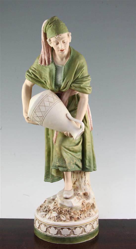 A large Royal Dux coloured biscuit porcelain figure of a Moorish water carrier, 50.5cm